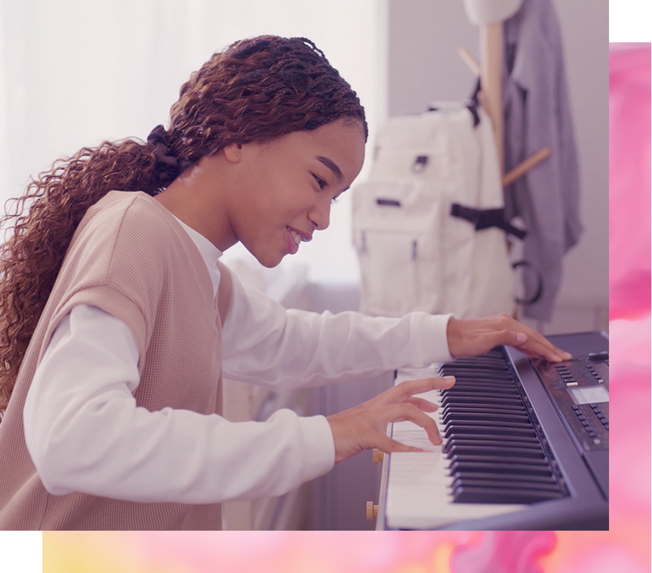 Young girl playing piano learning how to become a better musician